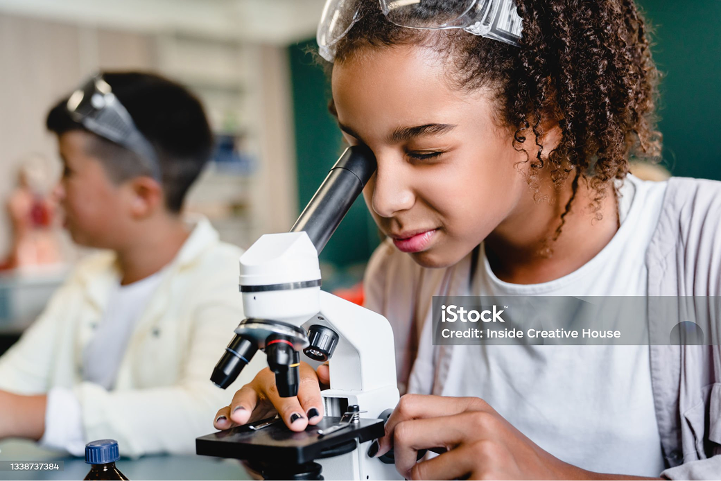 Student with microscope